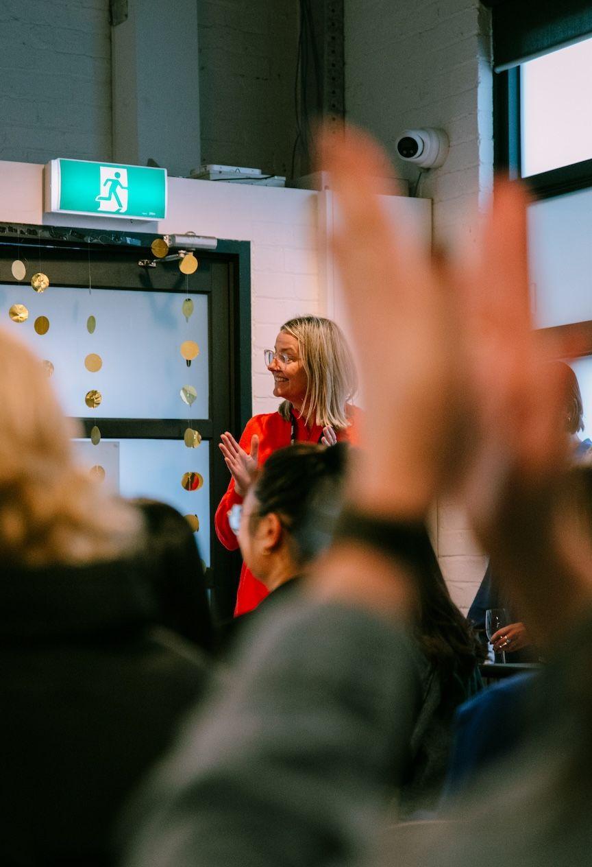 Jen claps as the B-Corp certification is announced to the wider ThinkHQ team. 